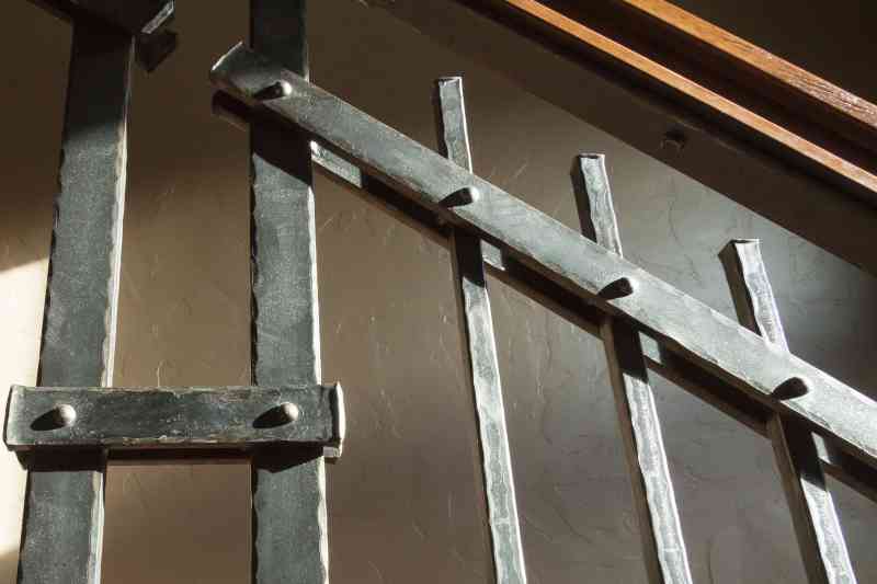 The steel hand railing was custom-built to fit this home's rustic theme.