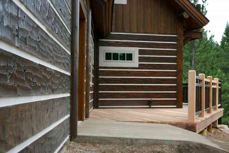 The hand-scraped log siding.