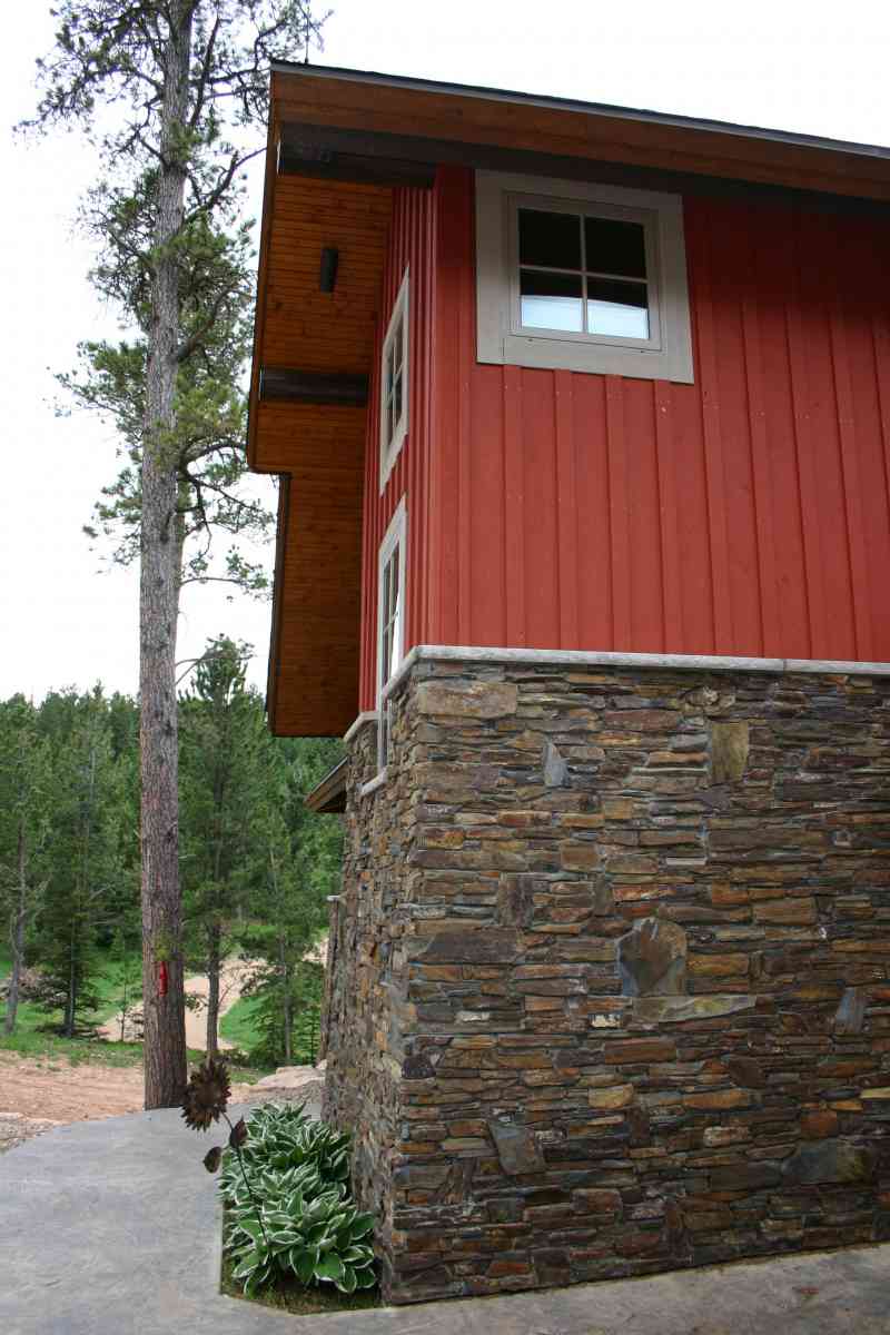 The red barnwood, board and baton accents.