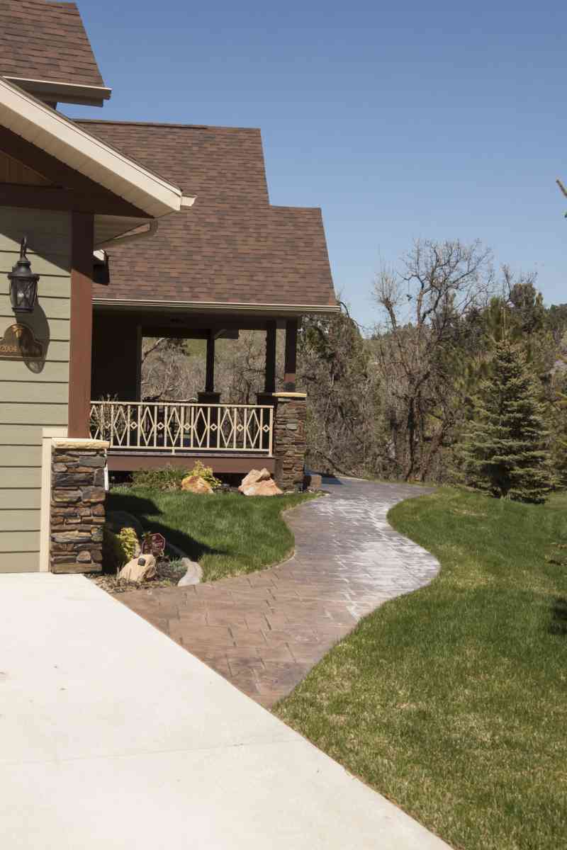 A winding, stamped concrete sidewalk.