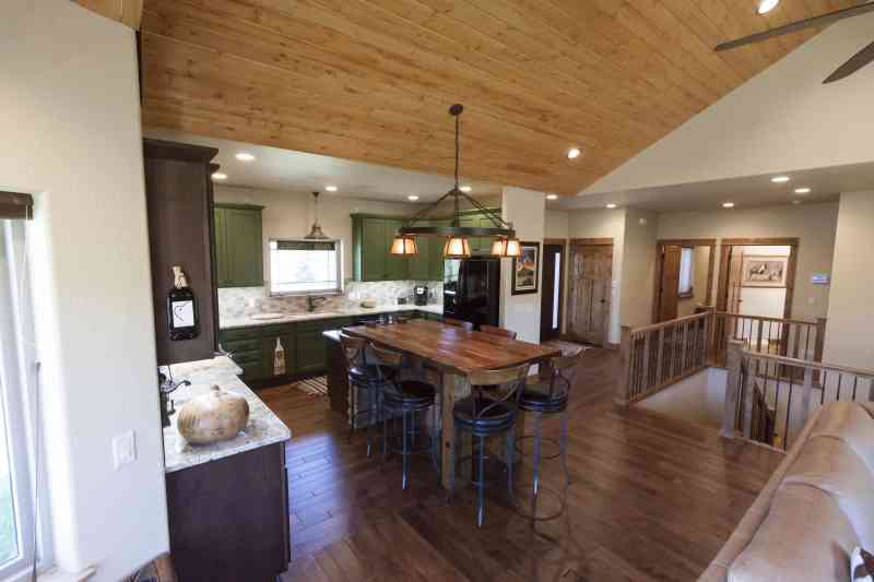 The kitchen and foyer as seen from the living room view.