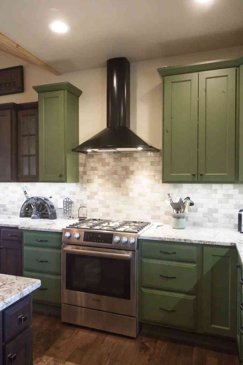 The range hood and its tile backsplash.
