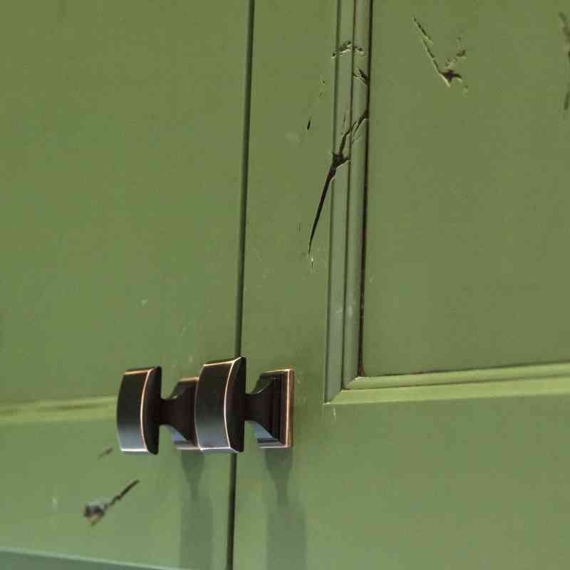 The oil-rubbed bronze cabinet hardware.