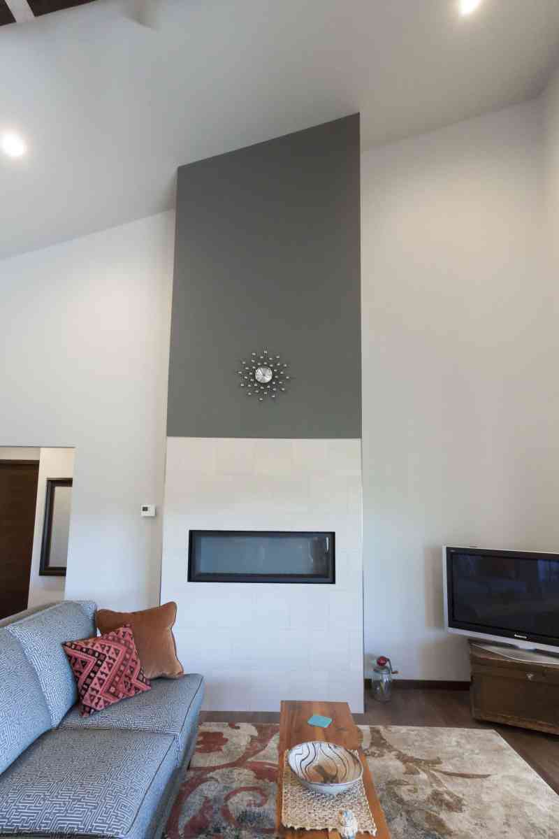 The sleek, tiled living room fireplace.