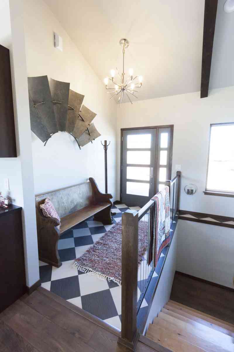 The main entry is located next to the basement stairway.