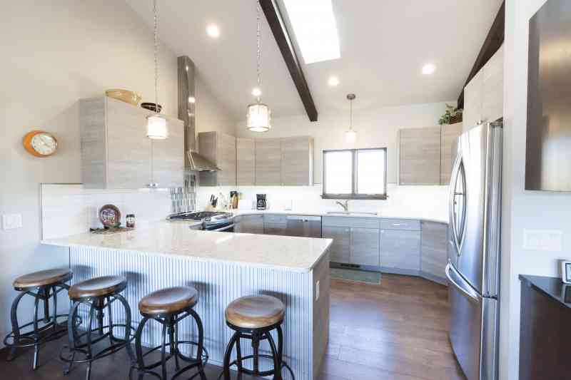 These sleek kitchen cabinets created a fresh look for this kitchen!