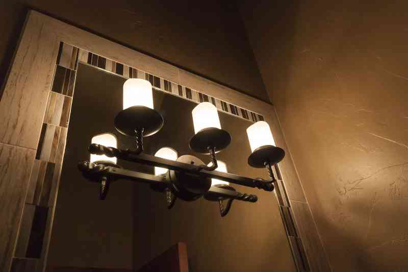 The vanity lights were cut into the mirror for a stunning finish.