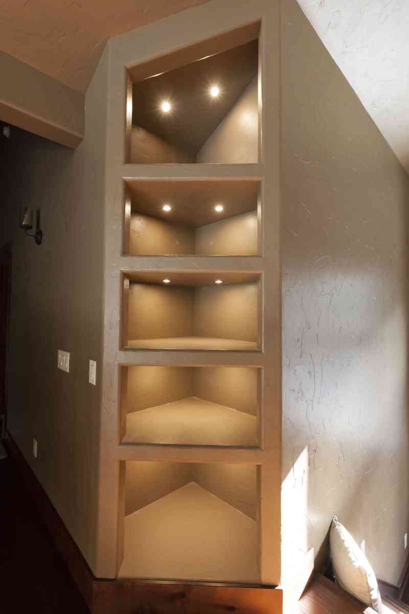Custom, built-in shelving with lighting.