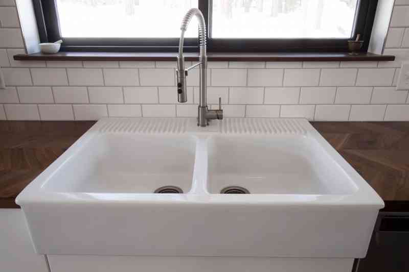 This kitchen is now complete with a large farmhouse sink!
