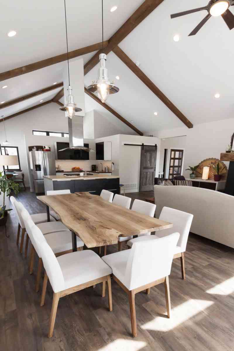 The custom, live-edged dining room table fits in perfectly with this open concept living area!