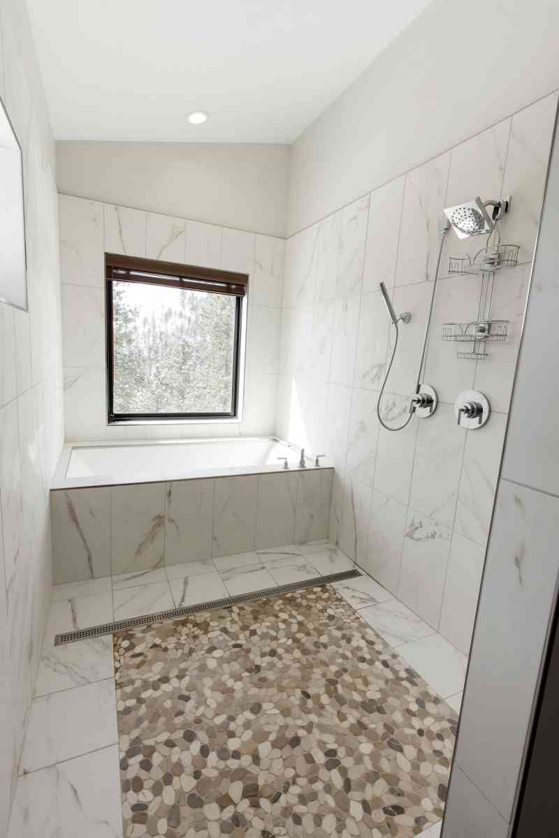 The tub and shower room provide a spa-like experience and overlook the canyon in the backyard!